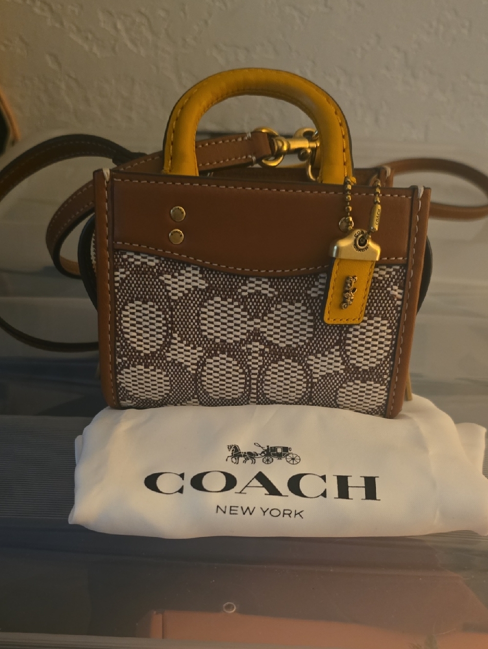 COACH Brown Signature Mini Rogue 12in with Yellow Accents.